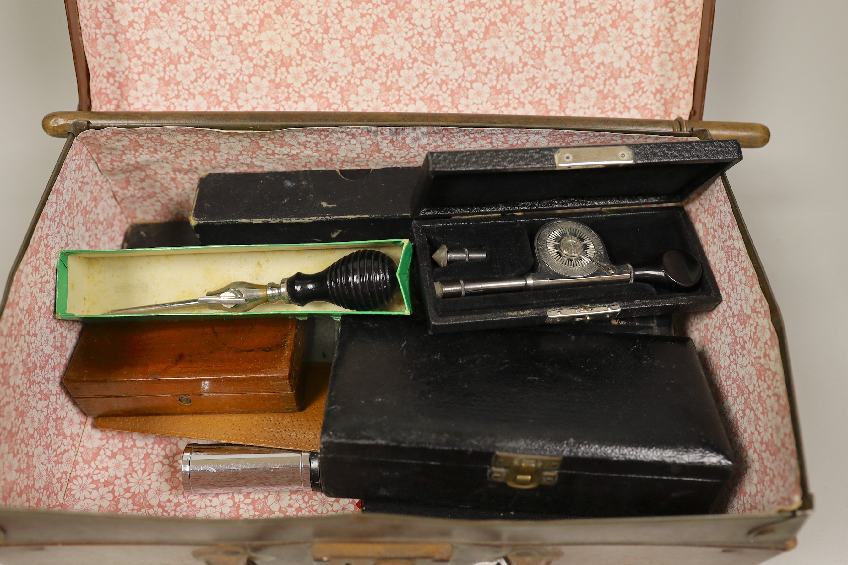 A small suitcase of draughtsman’s, scientific and medical instruments and a champagne tap